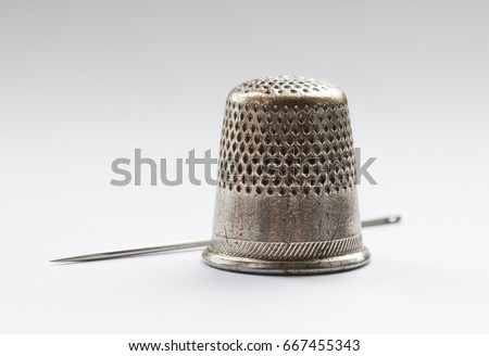 Vintage thimbles and sewing notions Royalty-Free Stock Photo #667455343