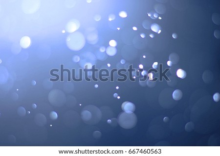 A beautiful and blurry bokeh on a blue background.