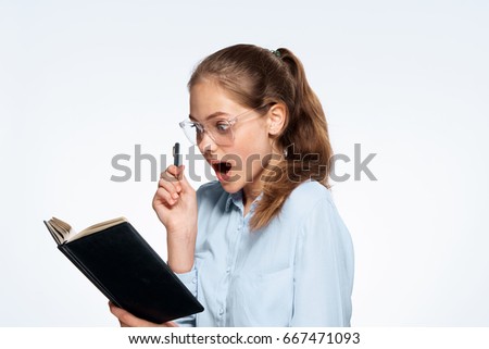 Woman with glasses and a notebook                               