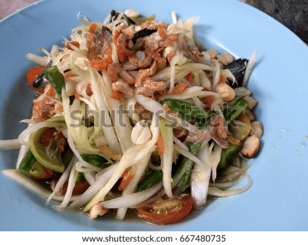 Spicy papaya salad with salted crab, dried shrimp, tomato, long bean and peanut