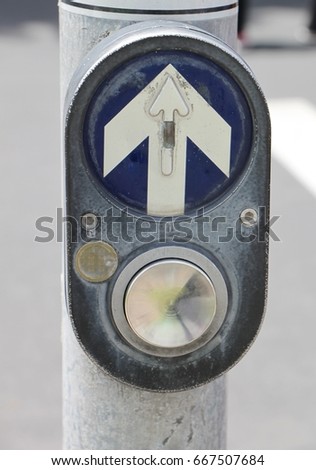 Push button to cross the road and wait in crossing area To wait for the lights