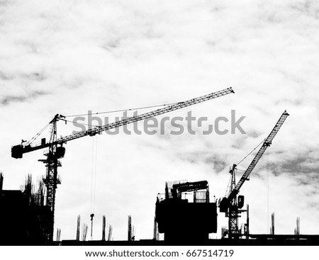 construction cranes on industrial construction site