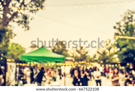 abstract blur image of  day festival in garden with bokeh for background usage . (vintage tone)