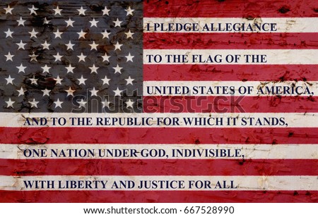 The pledge of allegiance written on a weathered United States of America flag Royalty-Free Stock Photo #667528990