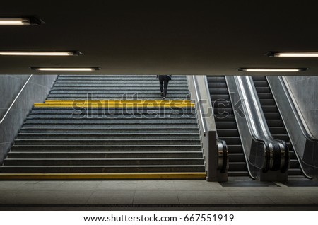 UNDERPASS -Woman going up the stairs from the underground passage