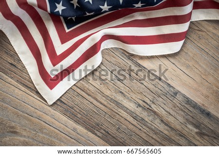 American flag background on wood.