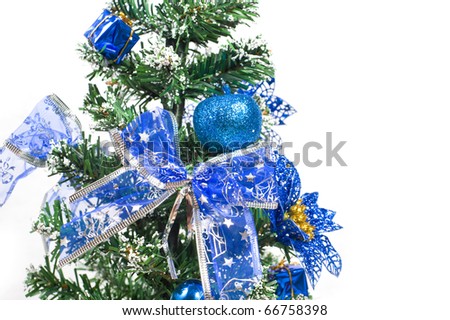 Close-up of decorated Christmas tree with cone, ornaments