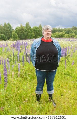 Tourist in lupine field