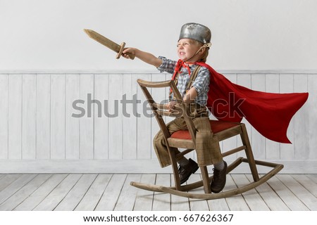 Portrait of the little boy in a suit of the knight Royalty-Free Stock Photo #667626367