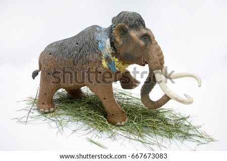 Toy mammoth on white background