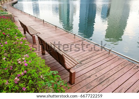 bench on wooden floor over lagoon