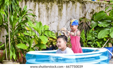 children playing water balloon 