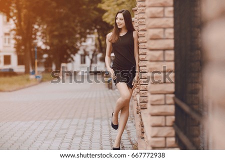 girl model walking around the city and posing for pictures