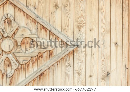 Texture, background, pattern. Part of the wooden gate decorated with patterns