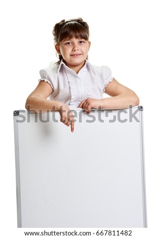 Schoolgirl pointing on whiteboard