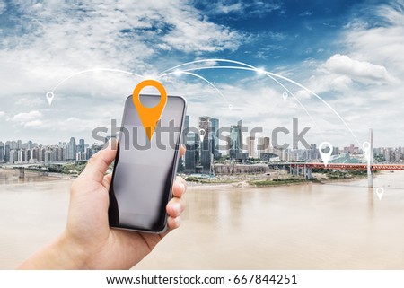 mobile phone with modern buildings by river in chongqing