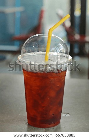 Plastic glass of cold iced black tea