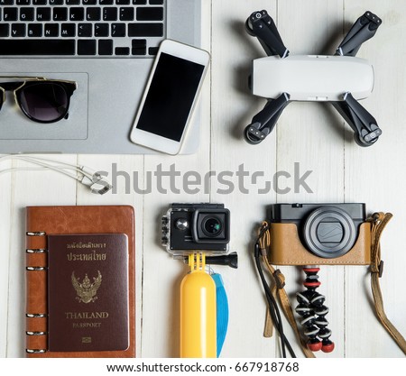 Technology Travel blogger Hi tech gadget and accessories for Video and photography including camera action cam drone laptop and mobile phone. for Modern travel Vacation Tech Gadget equipment concept. Royalty-Free Stock Photo #667918768