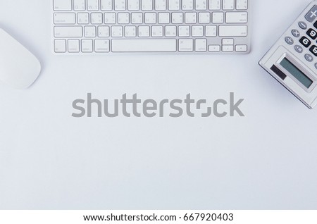 office desk and calculator on white clean space
