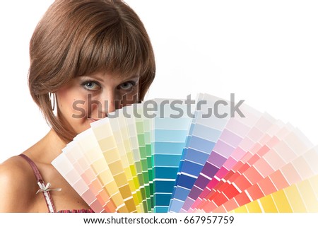 The beautiful girl with a color guide on a white background.