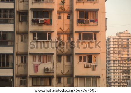 Facade of Old Apartment Building in Mumbai Royalty-Free Stock Photo #667967503