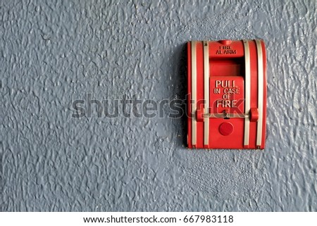 Fire Alarm on Concrete Wall.