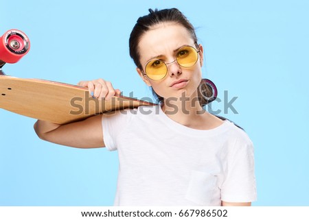 Sport, a woman with a skateboard                               