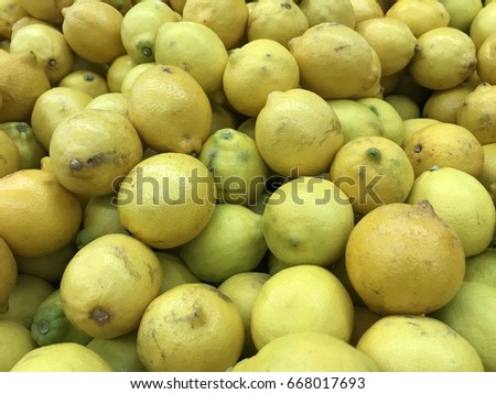 Citrus fruit or lemon sell in the market.The distinctive sour taste of lemon juice makes it a key ingredient in drinks and foods such as lemonade and lemon meringue pie