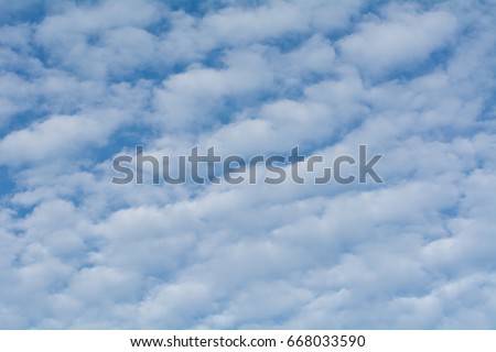 Fluffy white clouds with blue skies