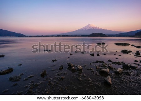 Beautiful scenery of Fuji mountain during sunset twilight time with clear sky at kawaguchiko lake. Wide angle. Warm tone picture.