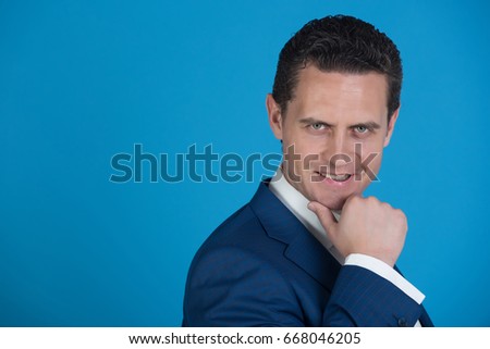 happy smiling business man on blue background, copy space