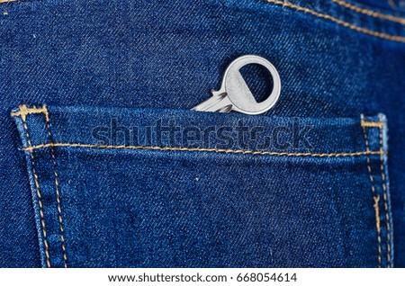Small silver key inside of jeans back pocket