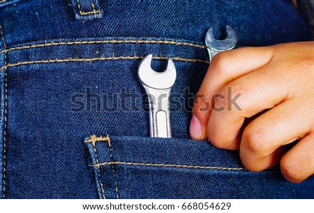 White cellphone inside of jeans back pocket