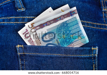 Money bill inside of jeans back pocket
