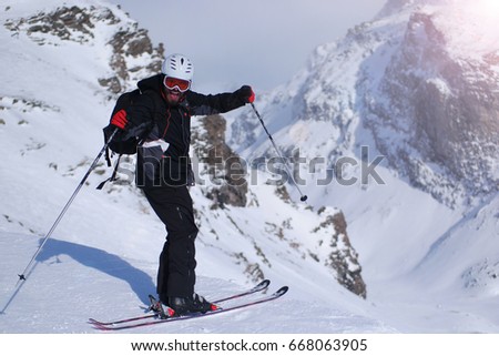 Skiing: male skier in powder snow. Italian Alps, Europe.