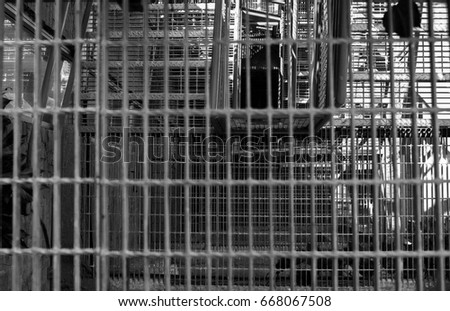looking down a metal grid staircase as abstract texture background