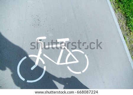 Bicycle image on asphalt.