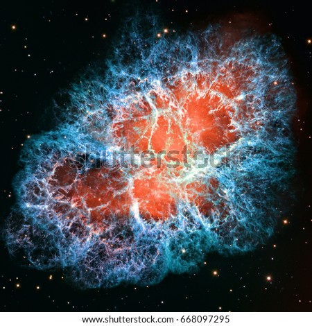 Detailed image of the Crab Nebula in constellation Taurus, blue and red colors, elements of this image furnished by NASA