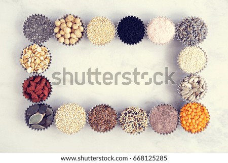Various superfoods, seeds, cereals, grains on a white background. Frame, layout. Top view, copy space for text