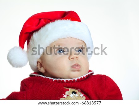 Baby girl wearing a Santa Claus hat