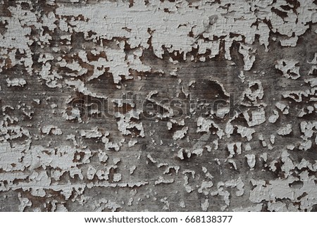 Wall texture background with peeling old paint.