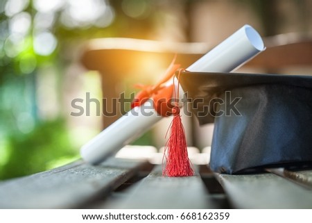 Graduation hat and diploma. Royalty-Free Stock Photo #668162359