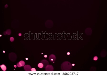 Pink bokeh abstract background caused by spray water.