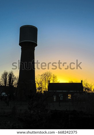 Sunrise. Sunrise in village. Village in early morning. Water tower. Old water tower. Country side in spring. Rural village landscape 