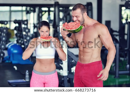 A group of people enjoy the gym eating food