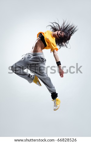 modern style dancer jumping on studio background Royalty-Free Stock Photo #66828526