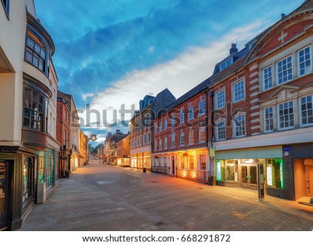 Winchester City centre High Street at night during mid-summer Royalty-Free Stock Photo #668291872