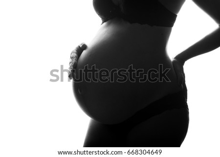 silhouette of Pregnant woman on a white background.