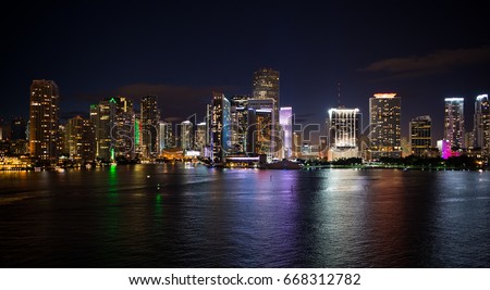 Miami skyscrapers at the night ,yacht or boat next to Miami downtown, Aerial view, south beach