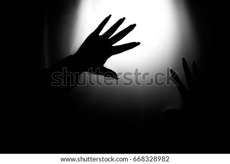Shadowed hands